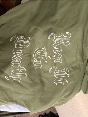 Olive Green Graphic Pullover Hoodie with White Gothic Text “rep it to death”